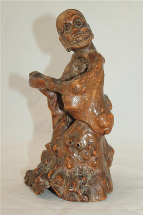 A Chinese rootwood carving of a luohan, 18th century, 23cm